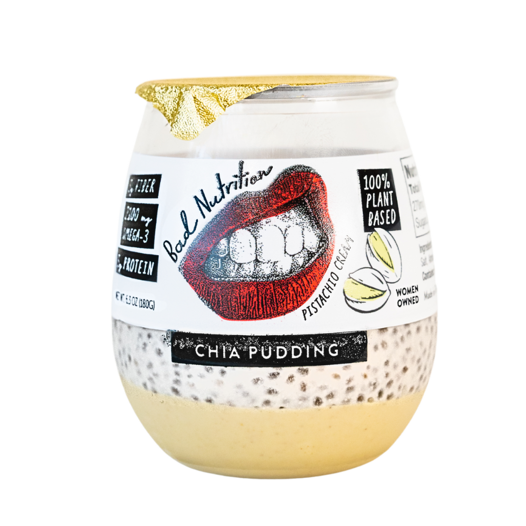 Jar of pistachio chia pudding with a colorful label on a white background